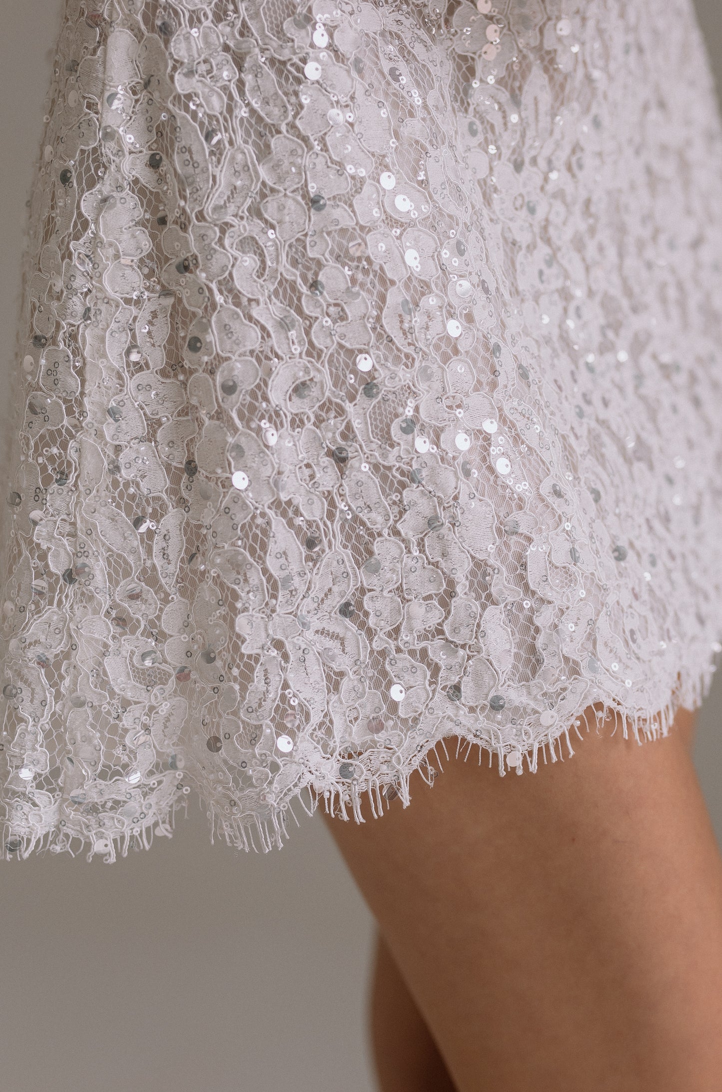 Mila reception dress detail view showing fabric details. Perfect as engagement dress, after party wedding dress or bridal shower dress.
