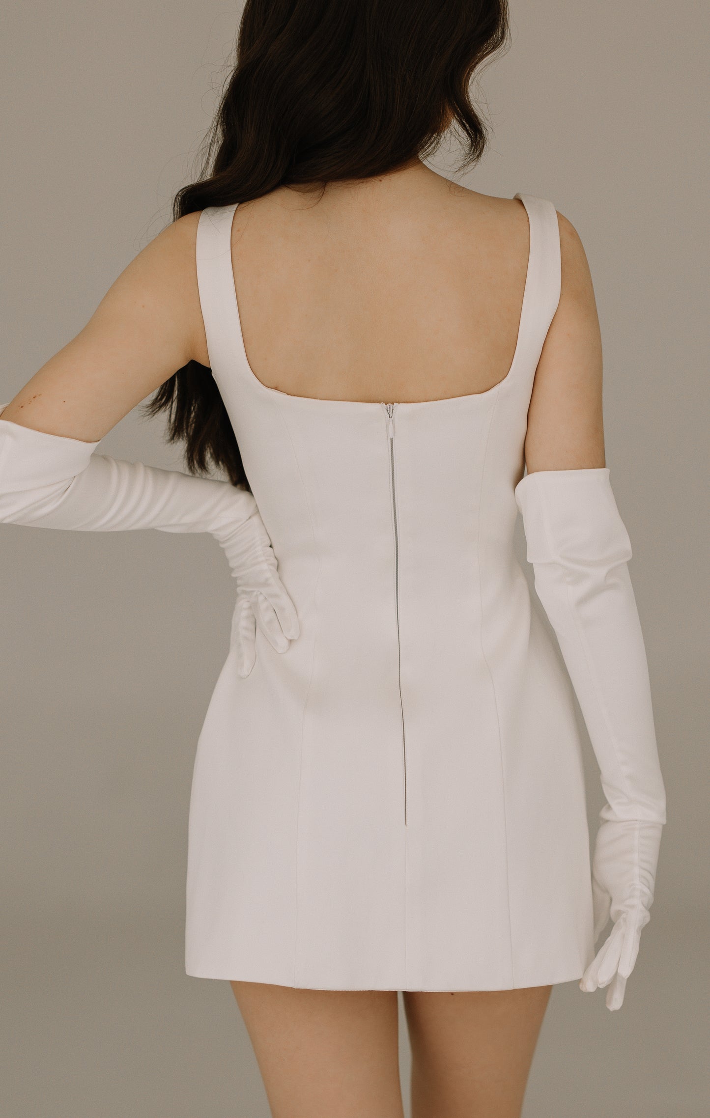 Everly dress back view showing sophisticated silhouette in premium heavy satin with crystal details