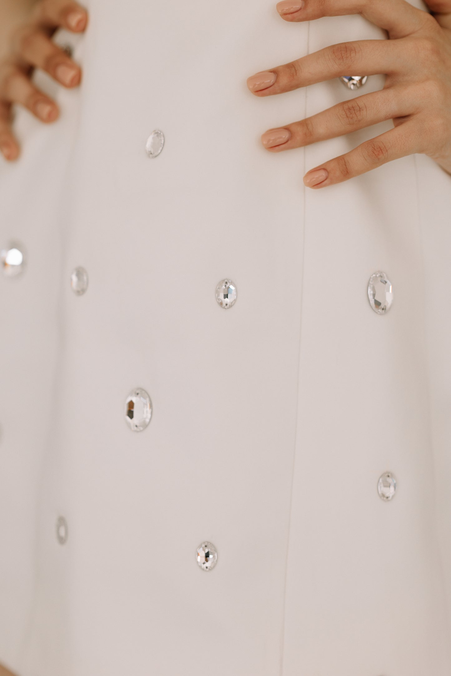 Everly dress detail showcasing genuine Swarovski crystal embellishments