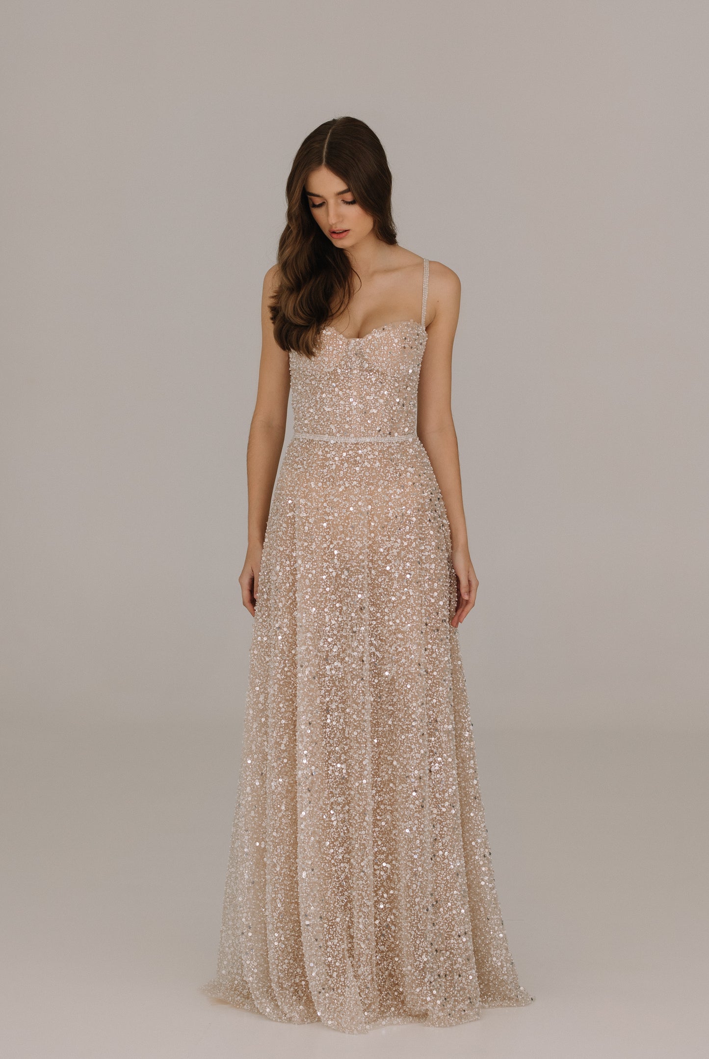 Celine dress adorned with sequins pearls and beads featuring elegant belt and straps for bridal celebrations
