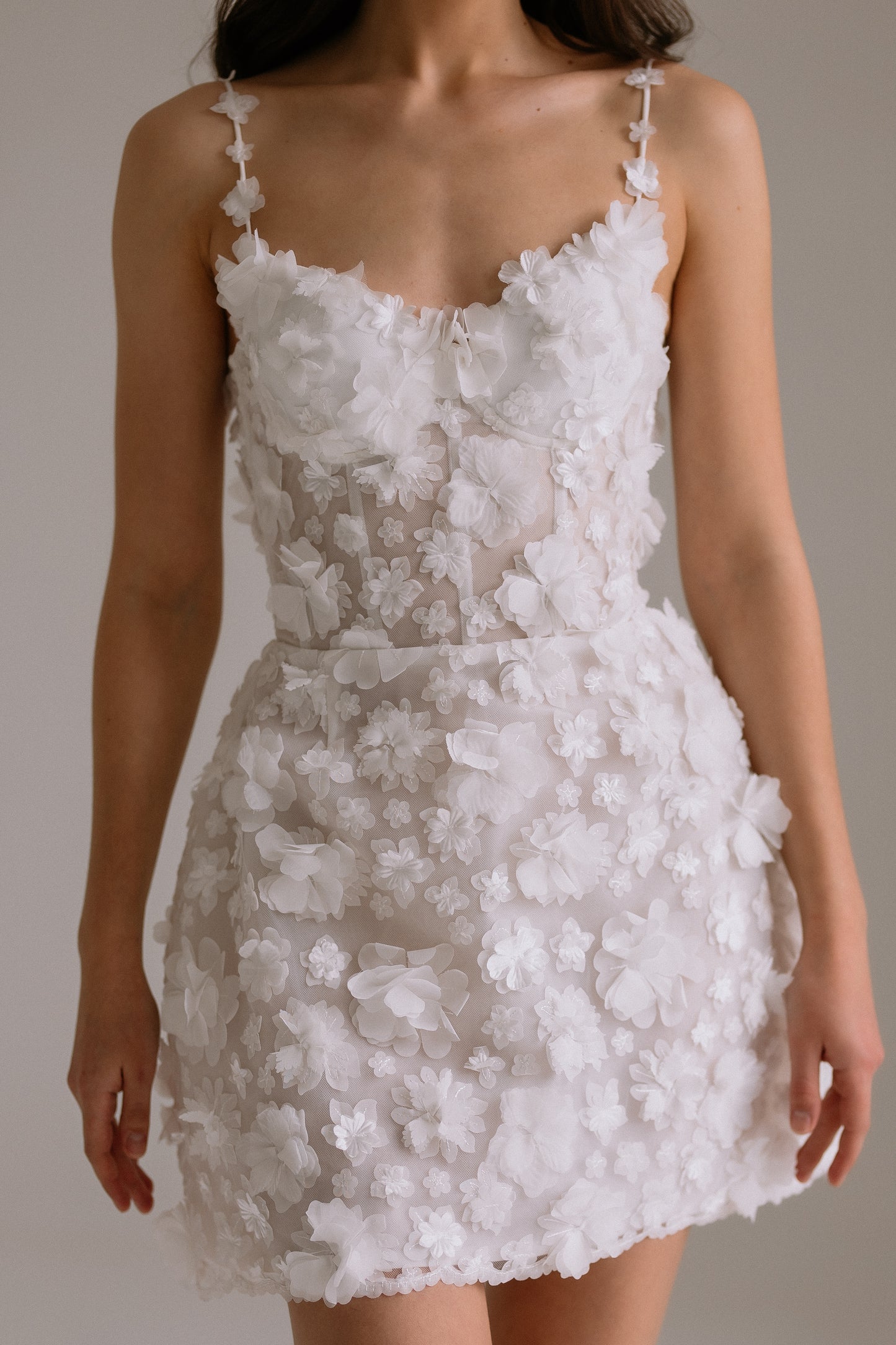 Flora short wedding dress close front detail view showing beautiful silhouette and fabric details with 3-D flowers. Perfect as engagement dress, after party wedding dress or bridal shower dress.