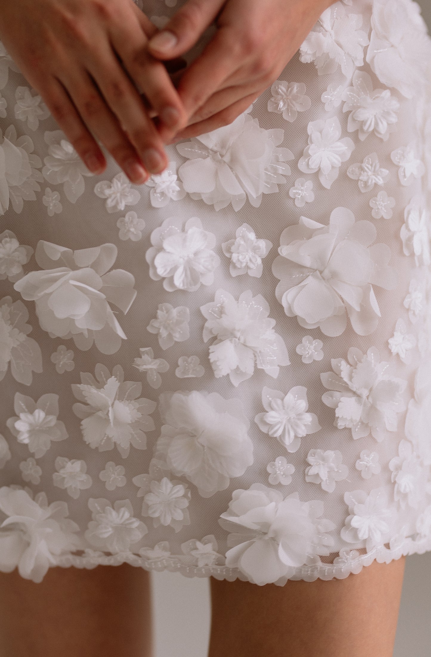 Flora wedding reception dress detail view showing 3-D flower fabric details. Perfect as engagement dress, after party wedding dress or bridal shower dress.