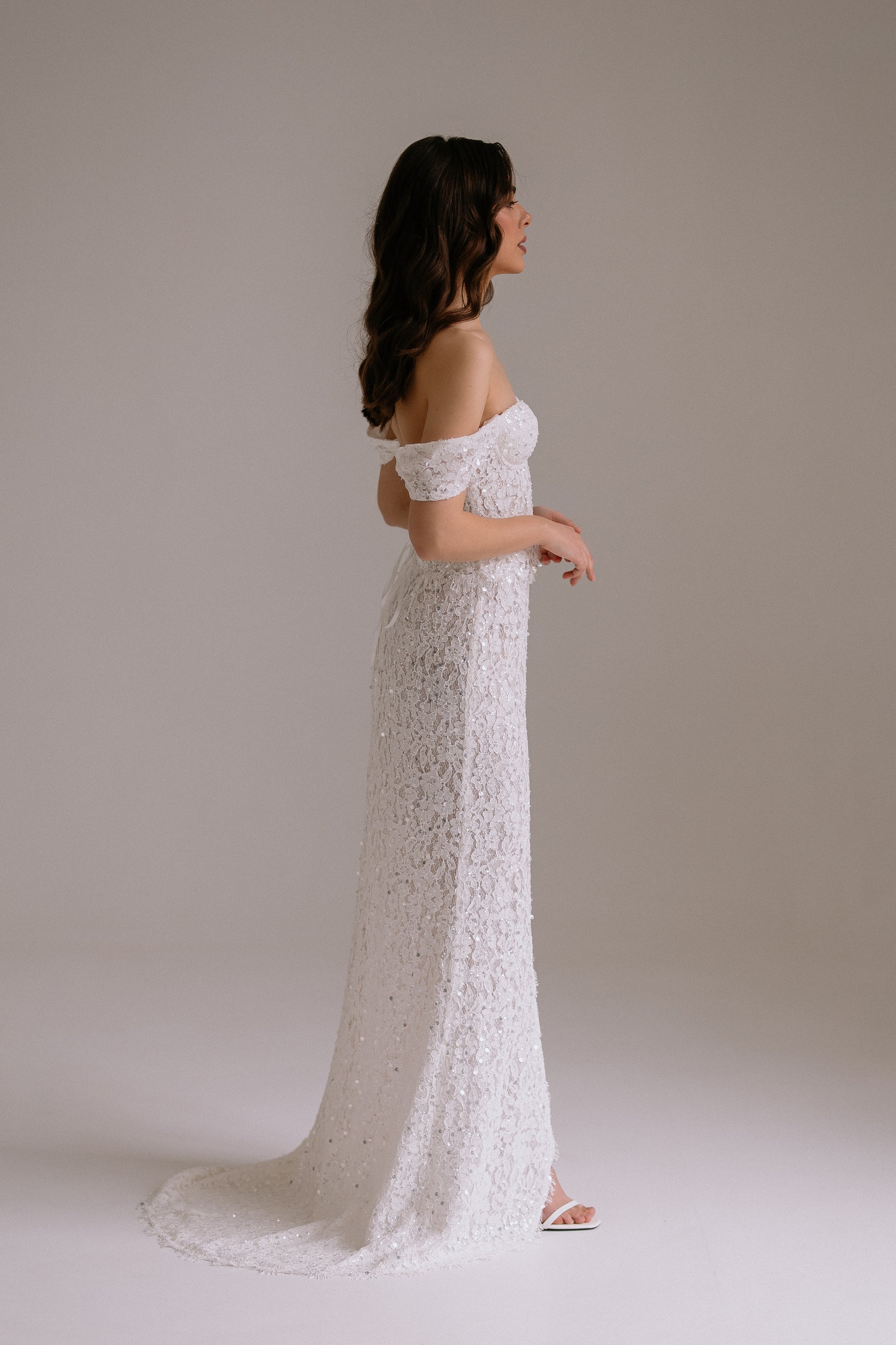 Alessia two piece set side view showing sophisticated silhouette with corset and flowing skirt
