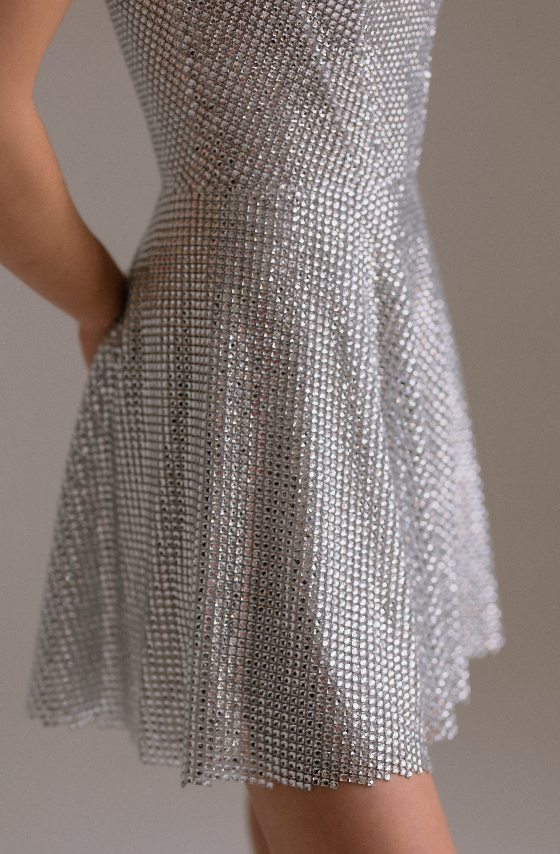 Aurora A-line skirt detail showing soft flowing fabric with sparkling crystal accents
