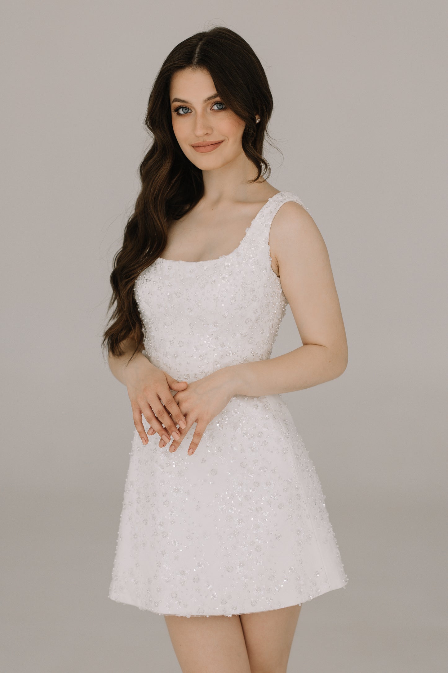 Dalia dress close front view revealing elegant silhouette in luxurious heavy satin and sequin flowers
