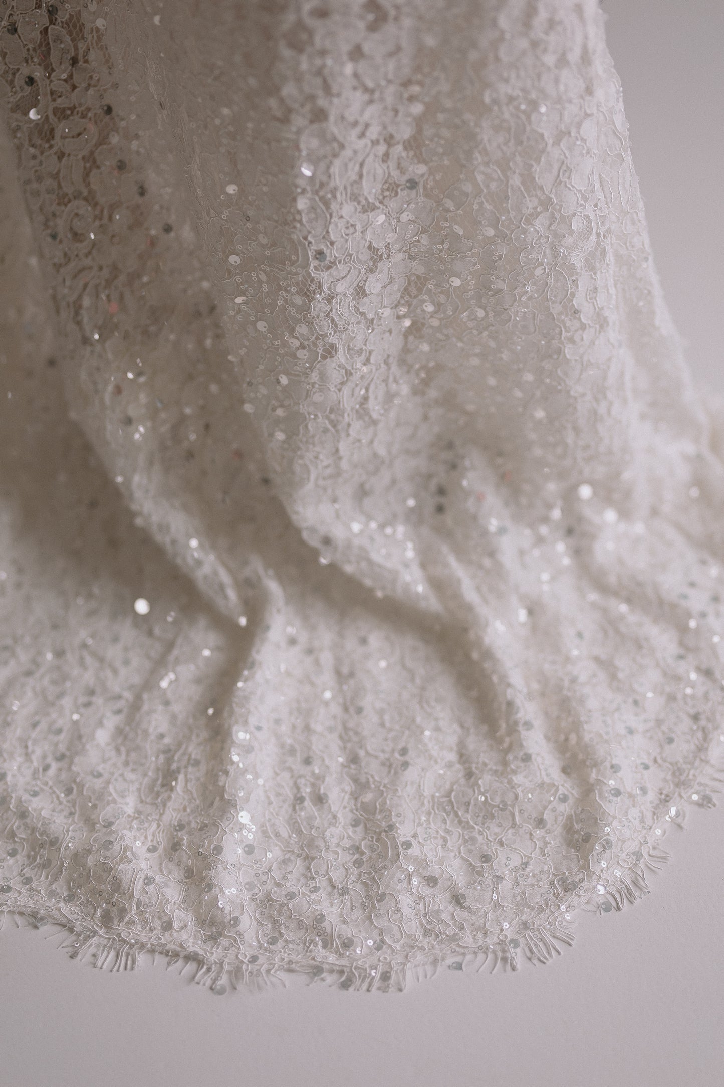 Alessia long skirt detail showing delicate sequin embellishments that catch the light
