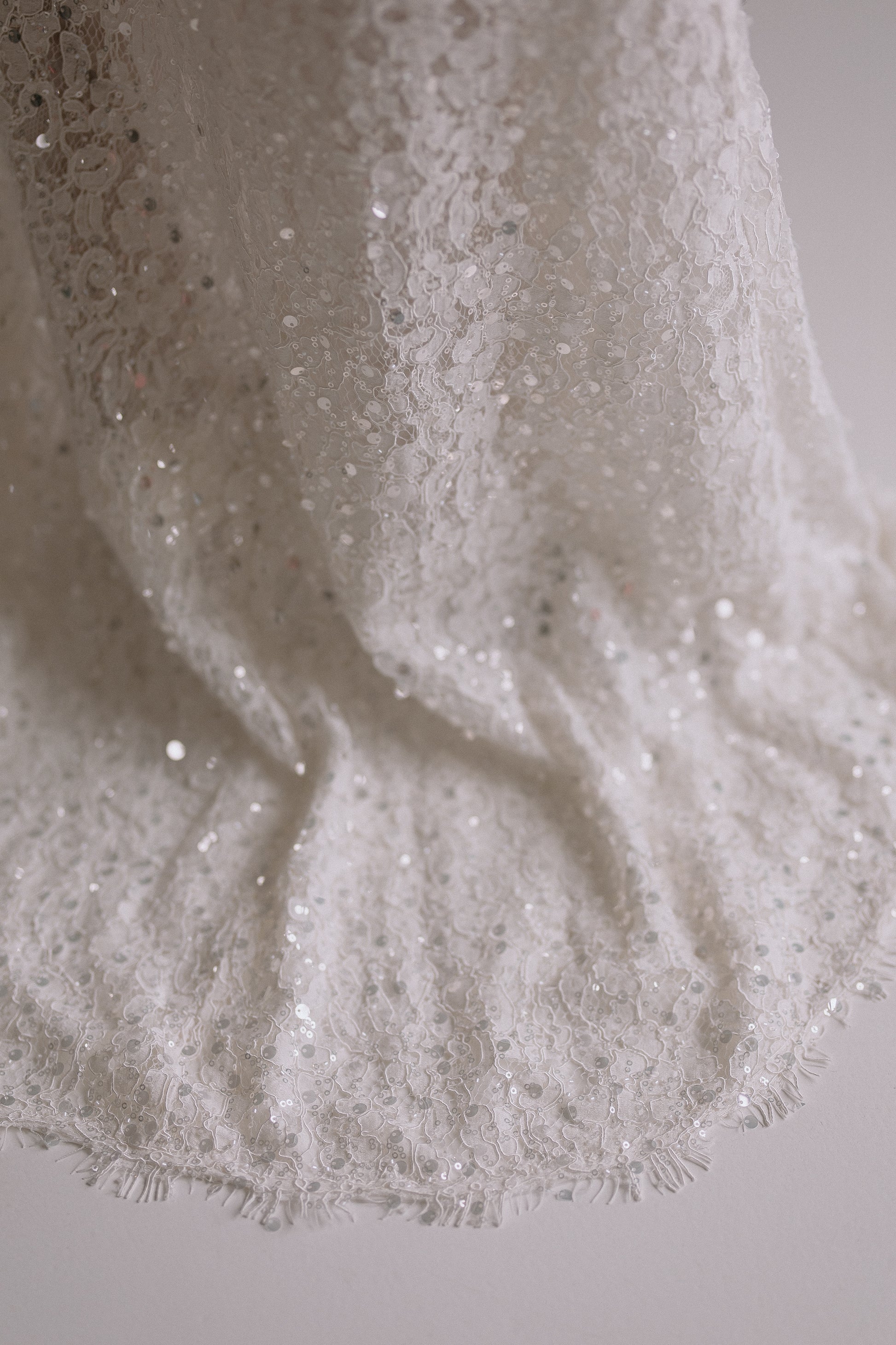 Alessia long skirt detail showing delicate sequin embellishments that catch the light
