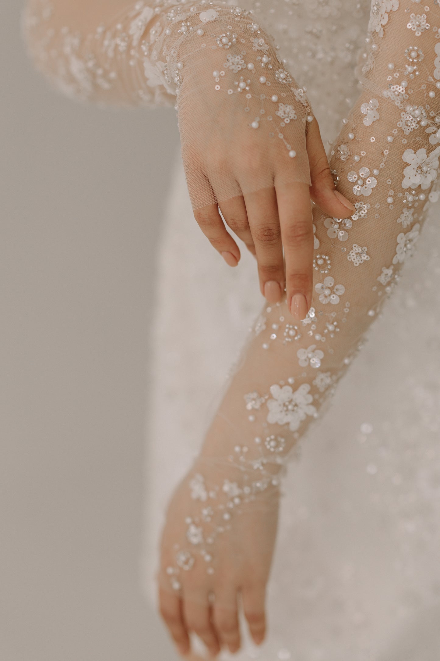 Dalia matching mesh gloves adorned with sequin flowers and pearl embellishments
