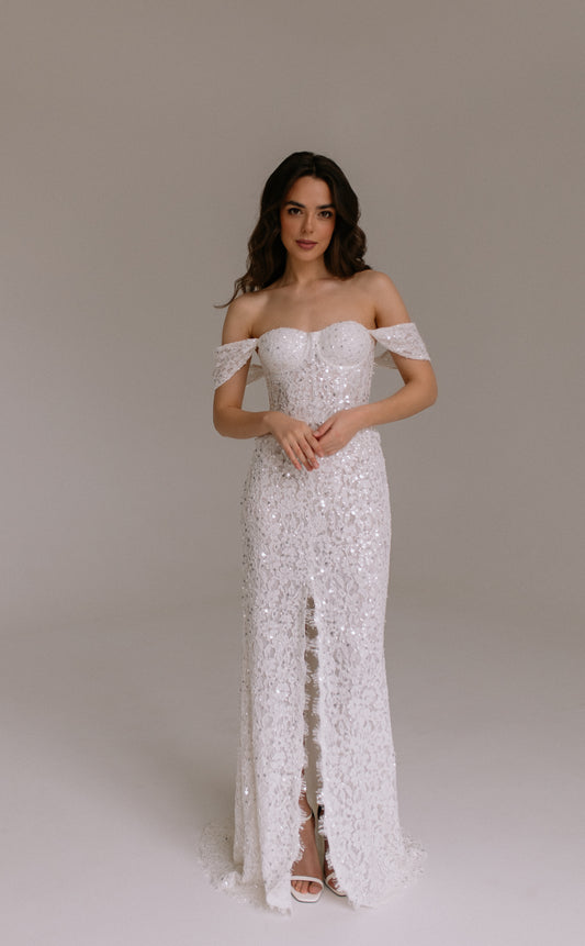 Alessia two piece set with lace up corset and sequined long skirt perfect for rehearsal dinner and bridal celebrations.
