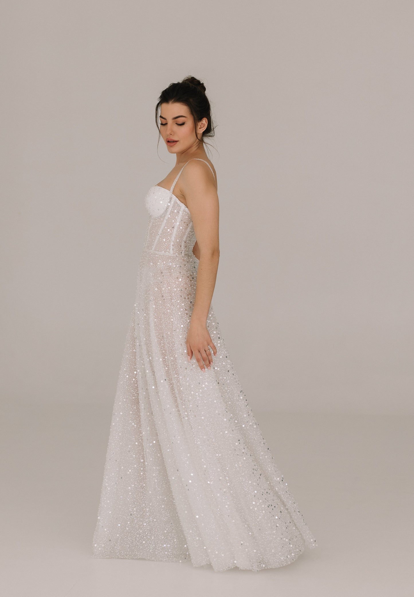Celine dress side view revealing feminine silhouette with fine belt detail
