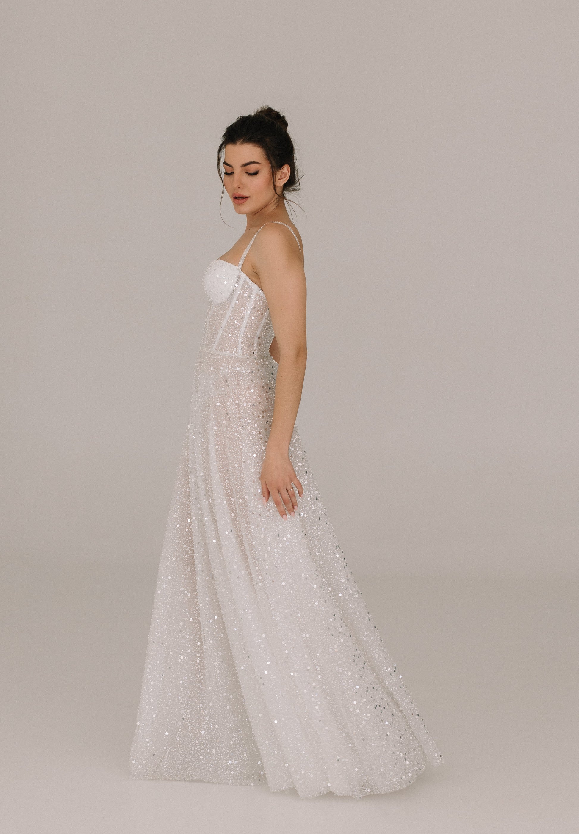 Celine dress side view revealing feminine silhouette with fine belt detail
