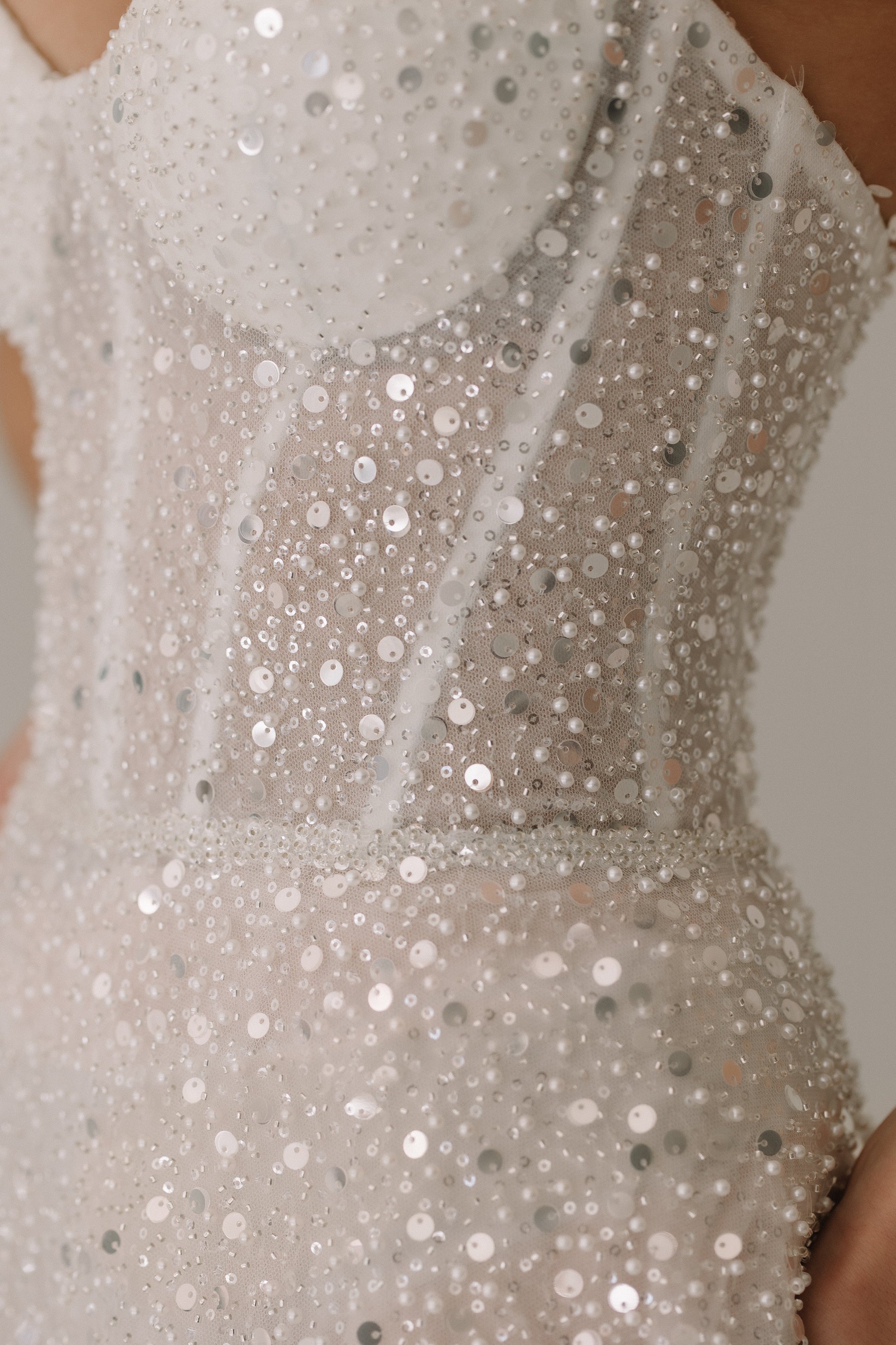 Celine dress fabric detail showing luxurious blend of sequins pearls and beading
